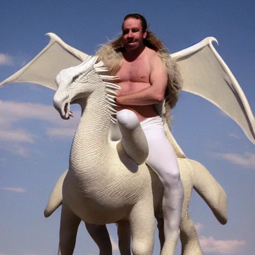 a caucasian man on a white dragon. just like the character in the never ending story
