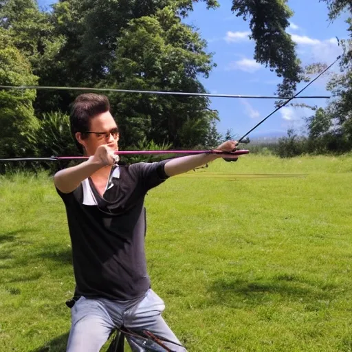 person using bow and arrow